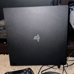 Play station 4 with head set, 2 controllers, and 12 games. Some are new.